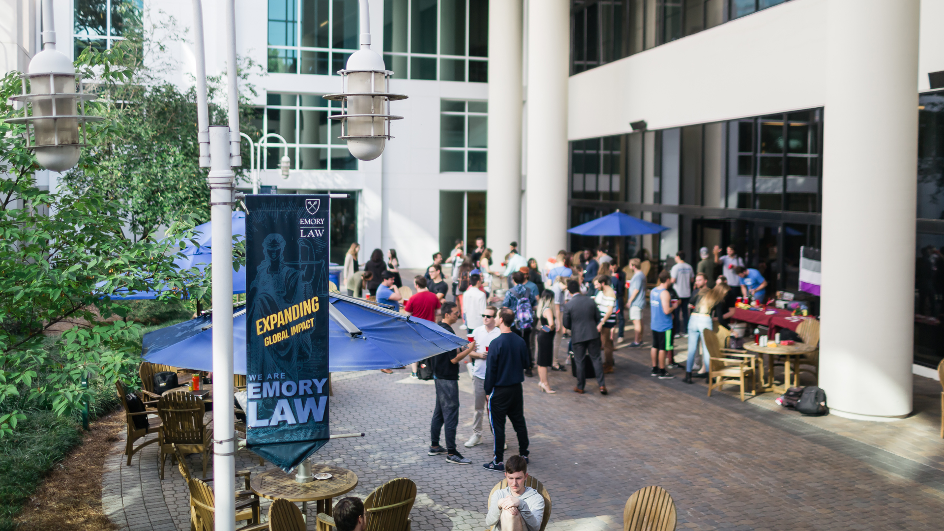 people gather on Bacardi Plaza